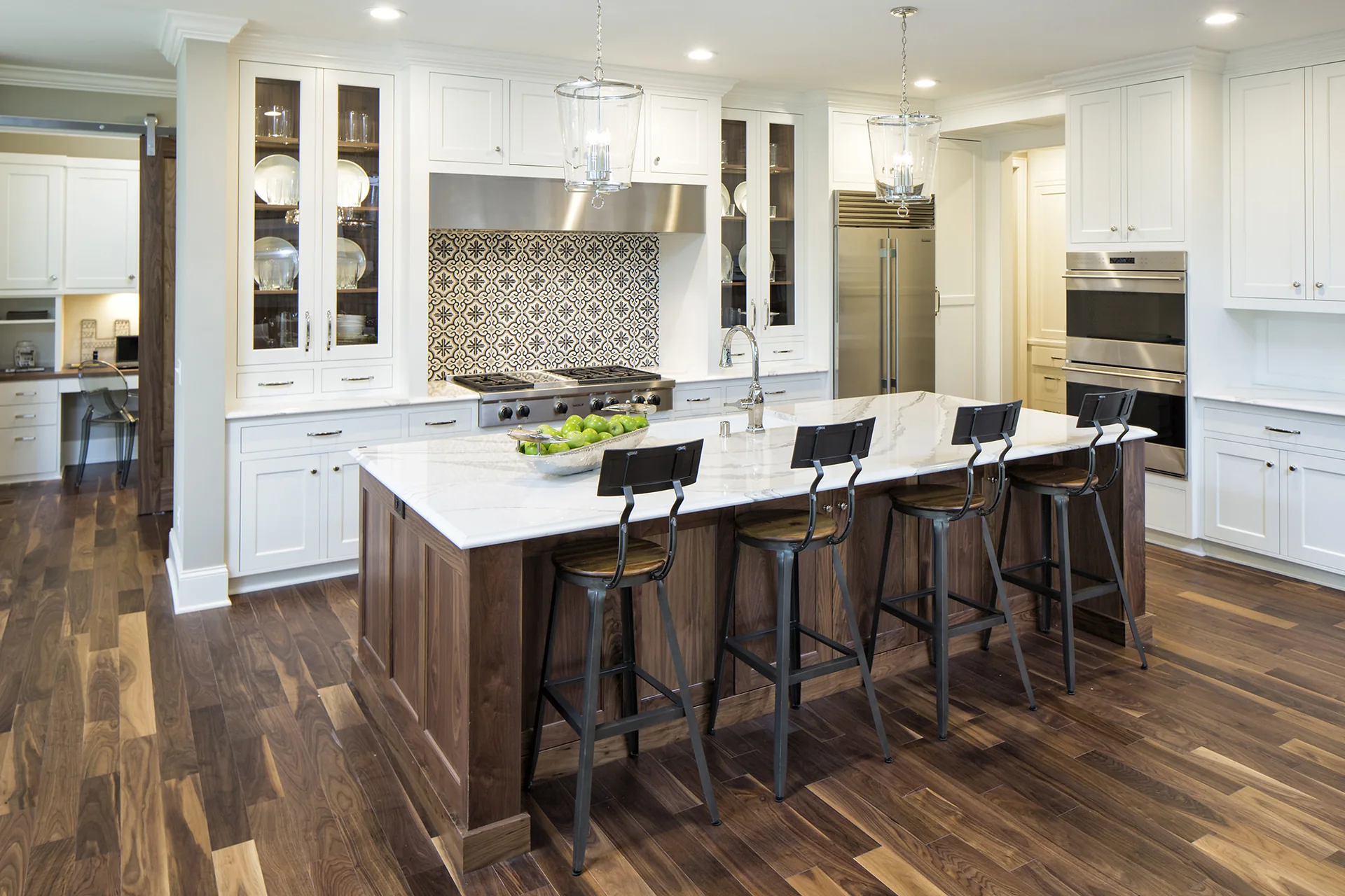 Rapid Granite kitchen with a light veined countertop and white cabinets
