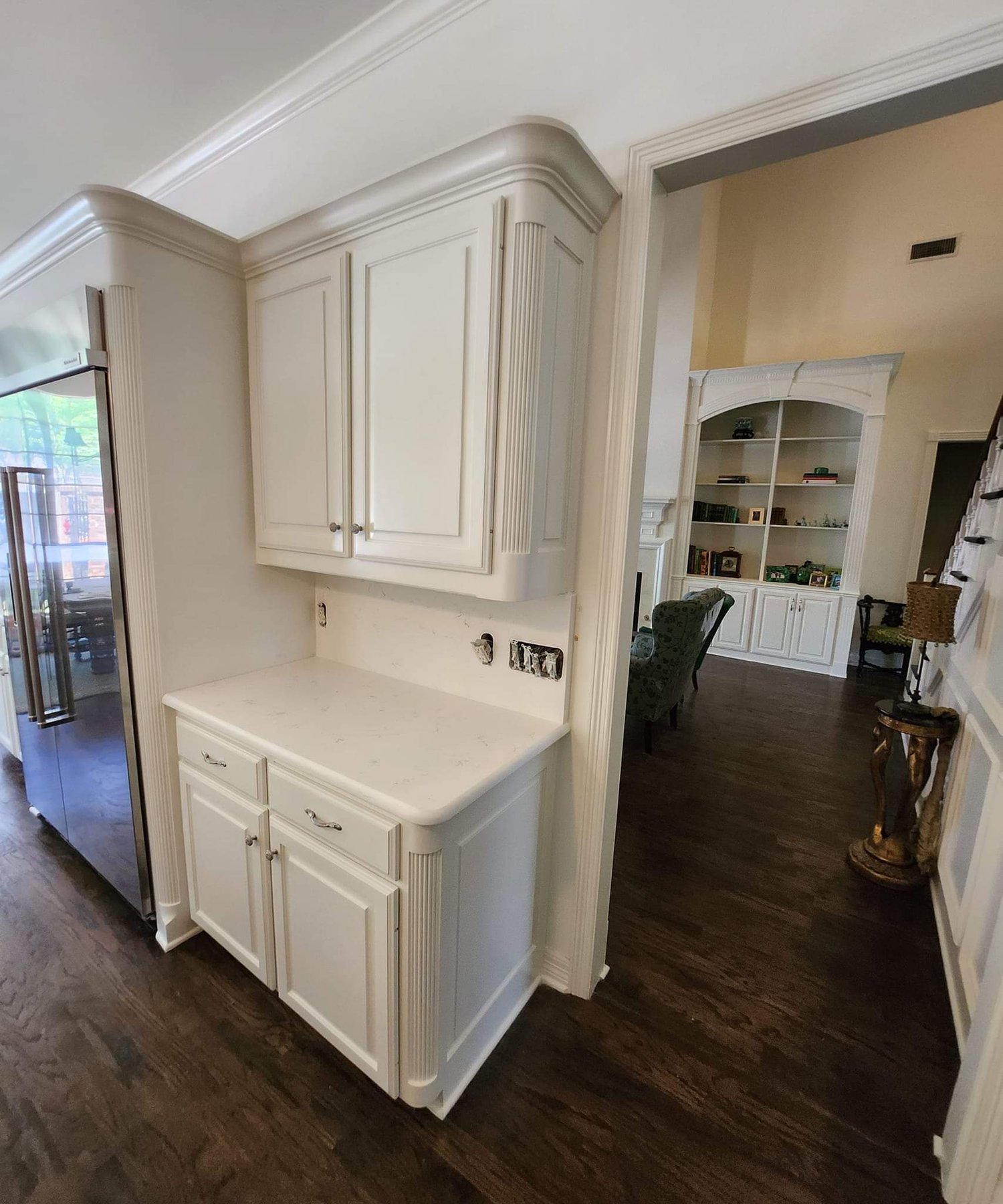 Walk-in shower with tile, niches, and a stone bench