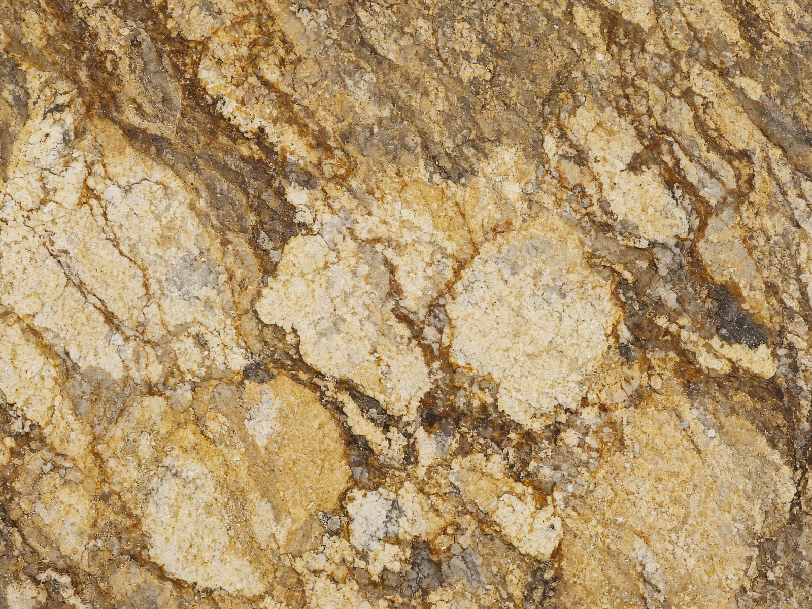 Giallo Ornamental granite — Warm gold and cream